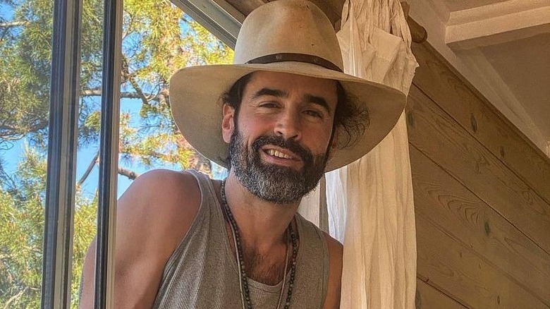 Jesse Bradford leaning through window