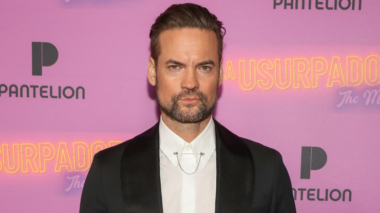Shane West with a serious expression