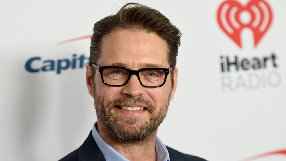Jason Priestley with black-rimmed glasses