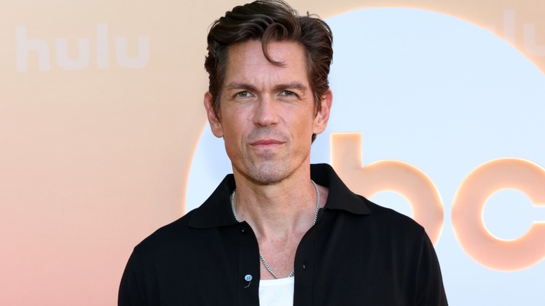 Sporting a monochrome look, Steve Howey shoots a cold glare at the camera.