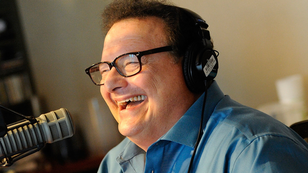 Wayne Knight laughs during a radio show