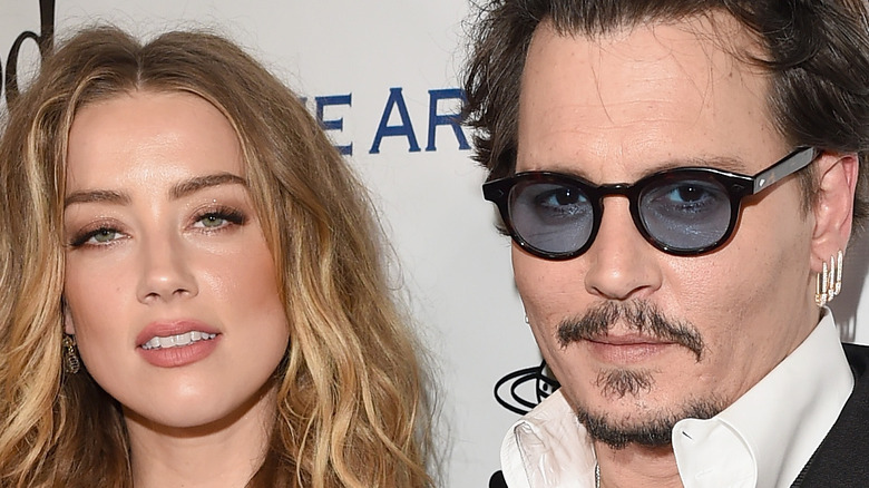 Johnny Depp Amber Heard posing