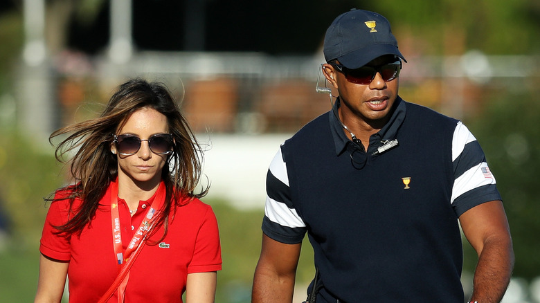 Tiger Woods, Erica Herman wearing shades