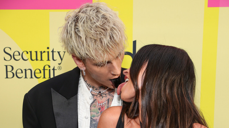 Machine Gun Kelly and Megan Fox kissing red carpet