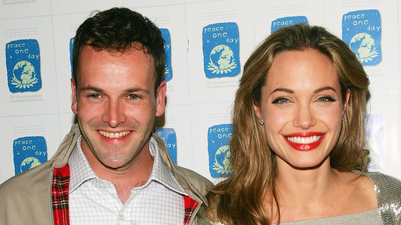 Jonny Lee Miller and Angelina Jolie smiling