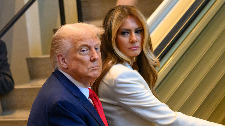 Donald and Melania Trump step on an escalator at UN's General Assembly in September 2025