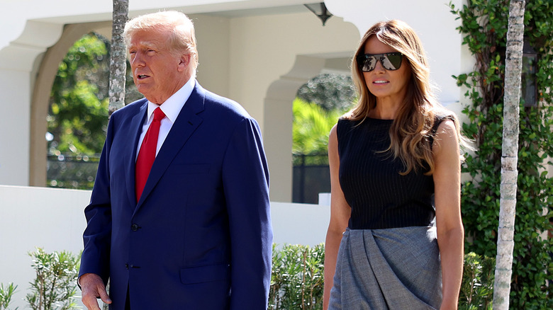 Donald and Melania Trump walking