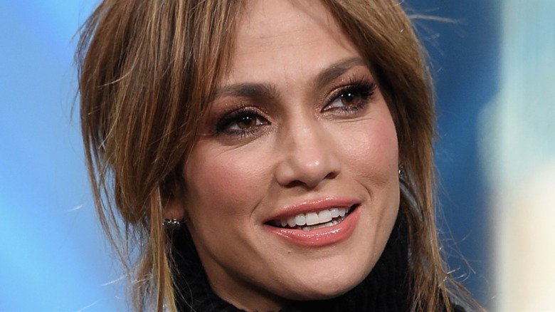 Jennifer Lopez smiling and looking to the side