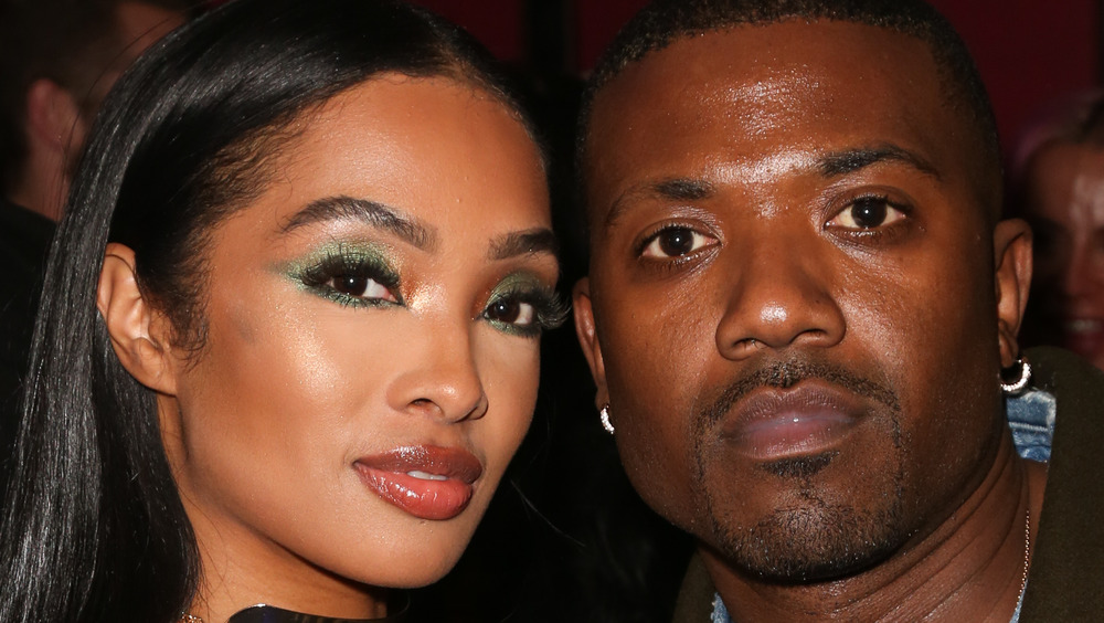 Princess Love and Ray J posing together at an event