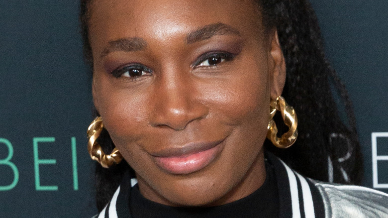 Venus Williams gold hoop earrings