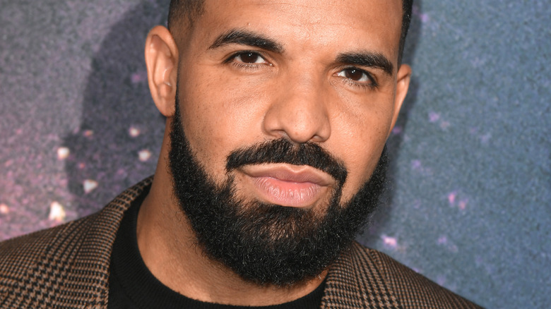 Drake slightly smiling