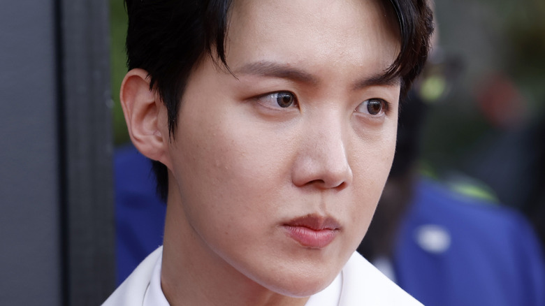 J-Hope looking sad white suit