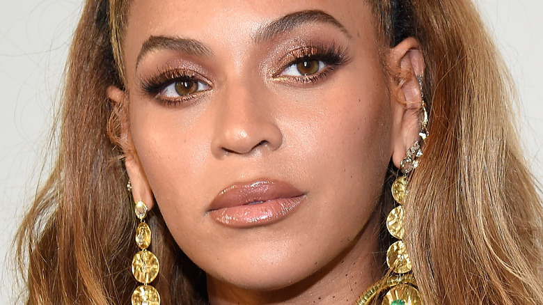 Beyonce wearing large gold earrings