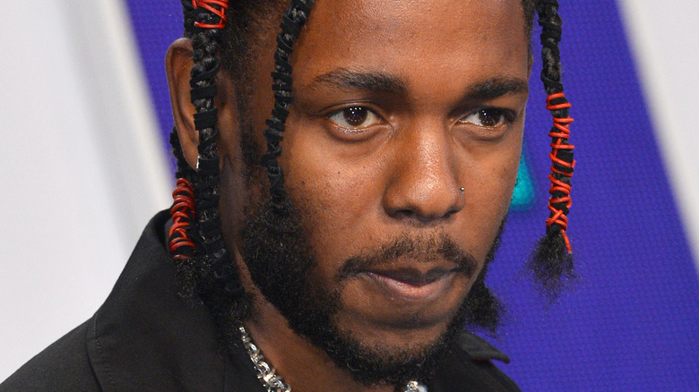 Kendrick Lamar with a serious expression