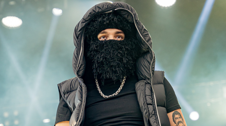 Yeat on stage in furry mask