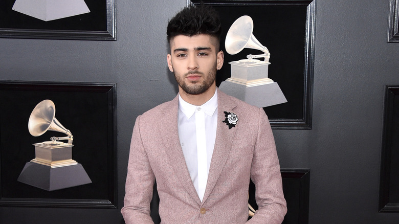 Zayn Malik posing in a suit