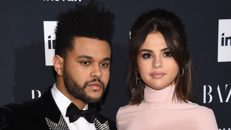 The Weeknd and Selena Gomez posing