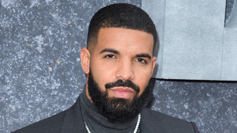 Drake in suit on red carpet
