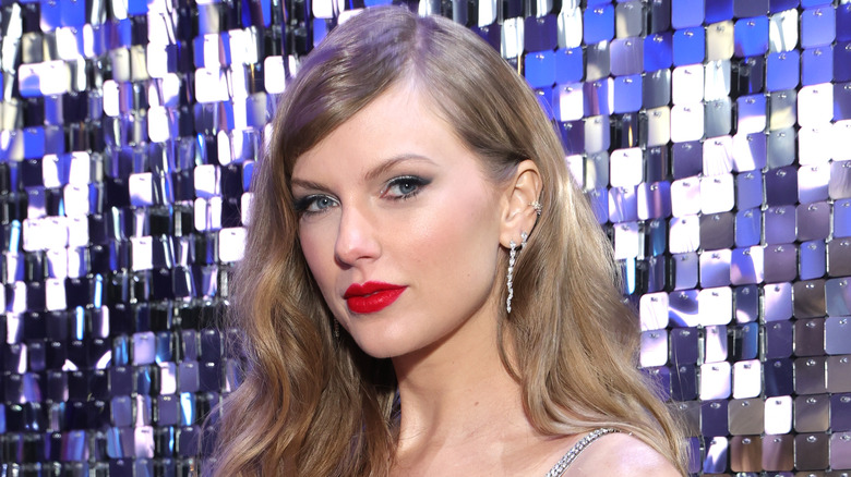 Taylor Swift poses in red lipstick