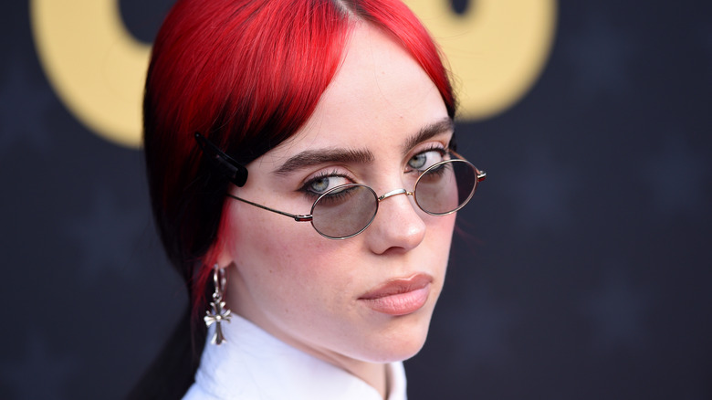 Billie Eilish looking over her shoulder in close-up