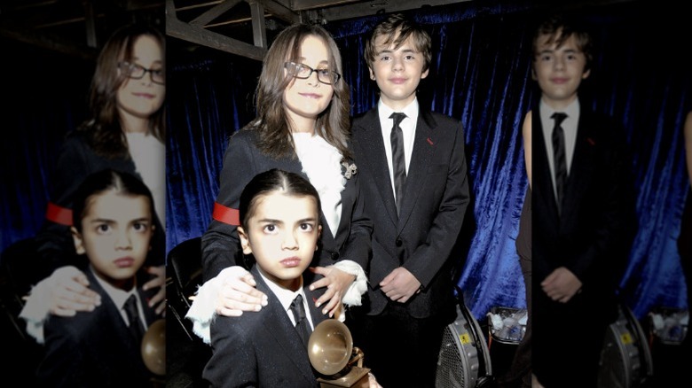 Paris, Prince, and Blanket pose with a Grammy in 2010.