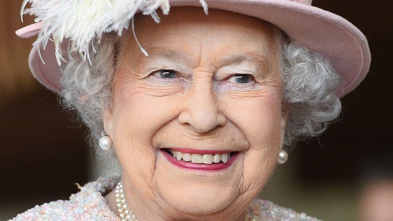 Queen Elizabeth smiles at an engagement