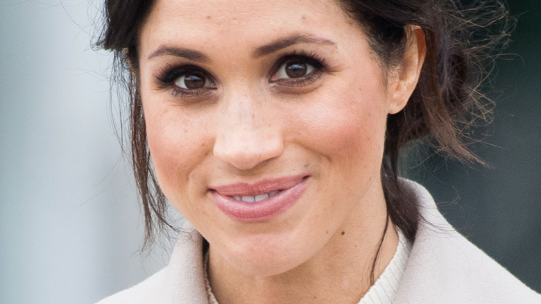 Meghan Markle smiling at camera