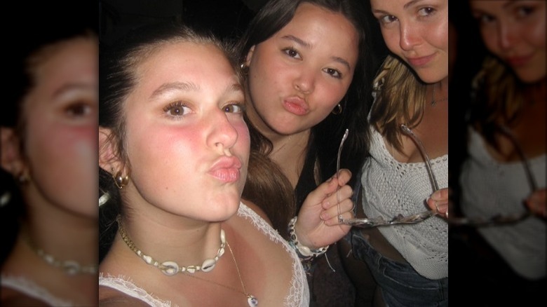 Leah posing with friends in college