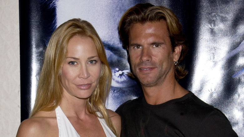 Kathleen Kinmont and Lorenzo Lama pose together.