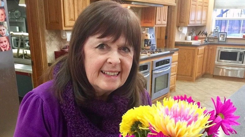 Mary Duggar smiling with flowers