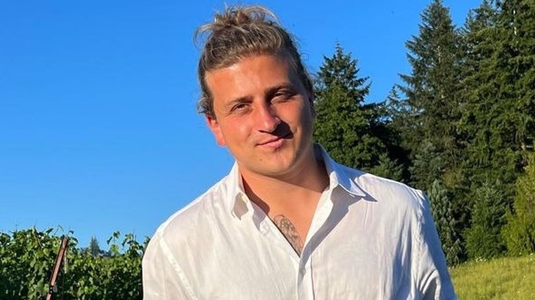 Joe Torgerson smiling in a field