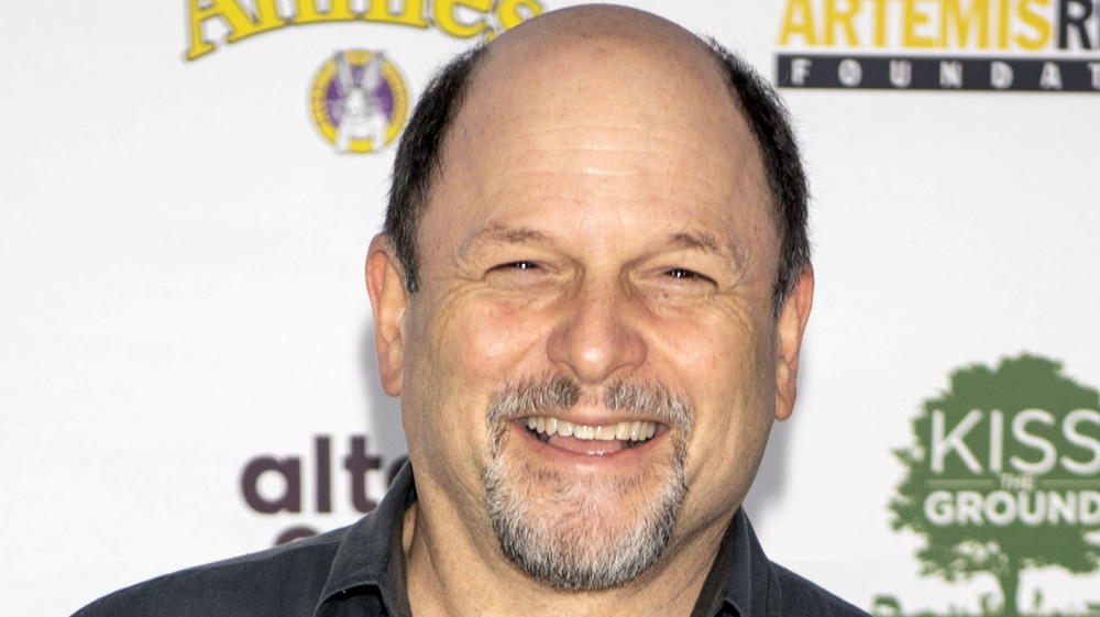 Jason Alexander smiling on the red carpet