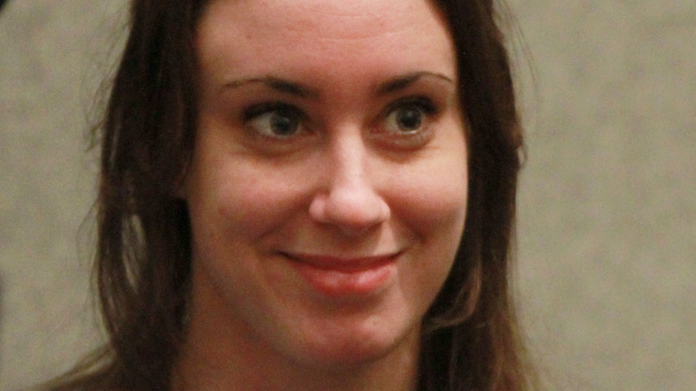 Casey Anthony, smirking, hair half up, photo from sentencing hearing