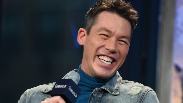 David Bromstad laughing with microphone
