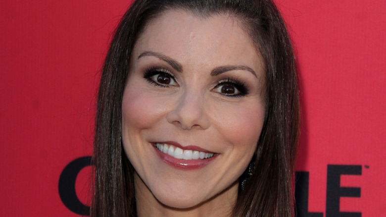 Heather Dubrow smiling on red carpet