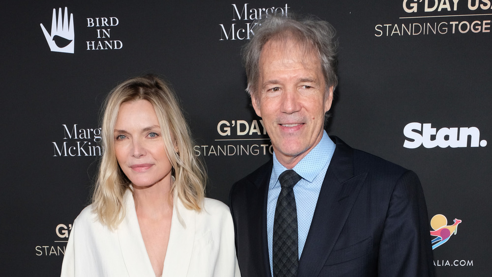 Michelle Pfeiffer and David Kelley posing
