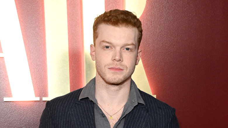 Cameron Monaghan red carpet striped black shirt