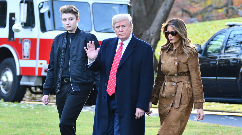 Barron Trump, Donald Trump, and Melania Trump walking