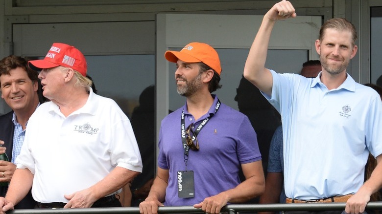 Tucker Carlson, Donald Trump, Donald Trump Jr., and Eric Trump attend the LIV Golf Tournament in Bedminster, NJ (2022)