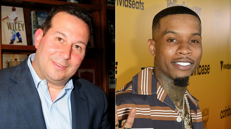 Joze Baez smiling and Tory Lanez smiling while holding up the peace sign