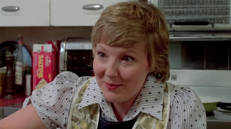Miriam Flynn in a kitchen as Cousin Catherine in 
