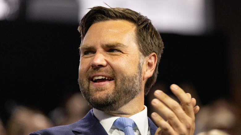 JD Vance clipping his hands and smiling