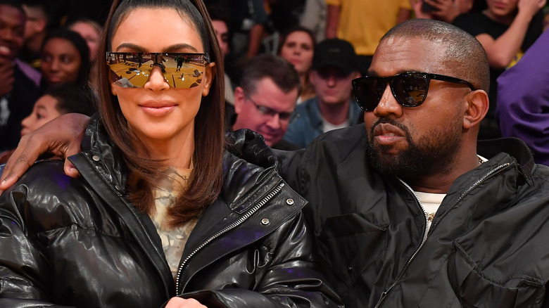 Kim Kardashian and Kanye West at a basketball game