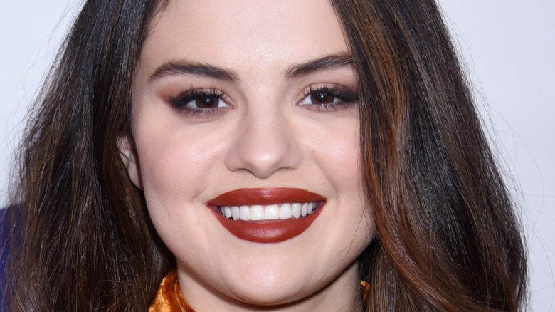 Selena Gomez smiling red lipstick