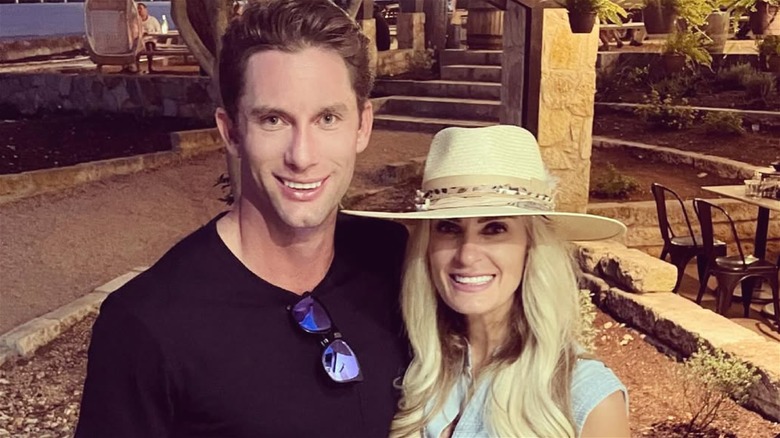 Kalon McMahon posing and smiling in a photo with girlfriend Emily Lottman