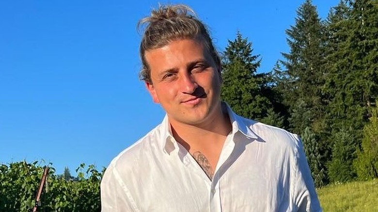 Joe Torgerson smiling in a field