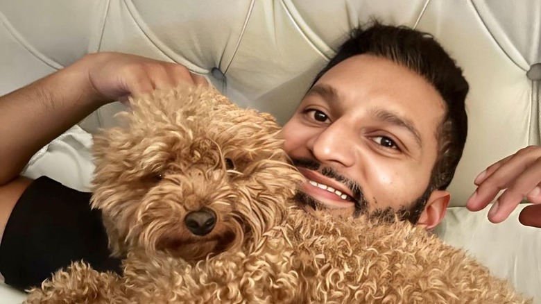 Abhishek "Shake" Chatterjee poses with his dog