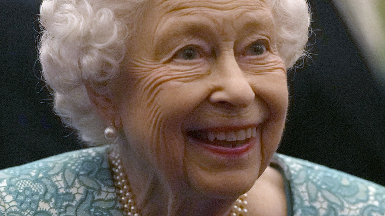 Queen Elizabeth II smiling at Windsor Castle