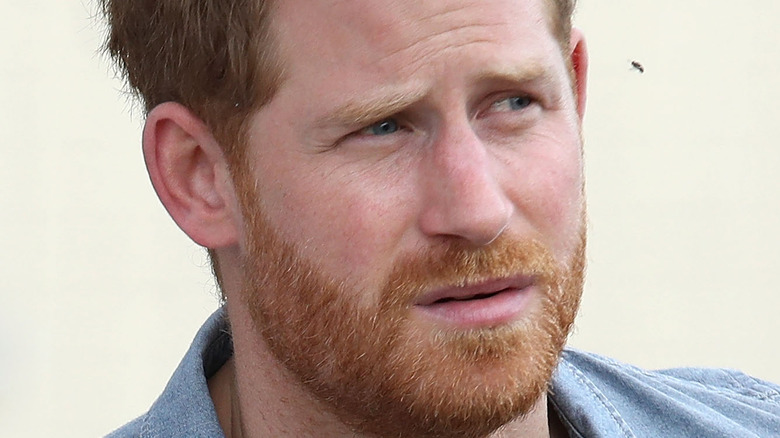 Prince Harry frowning