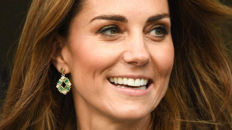 Kate Middleton smiles at a royal outing